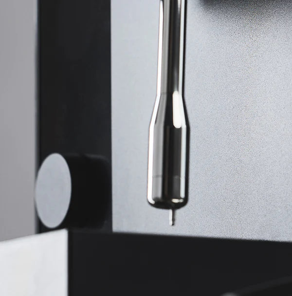 Close-up of the sleek design of the Fellow Espresso series 1 espresso machine, showcasing its precision components.